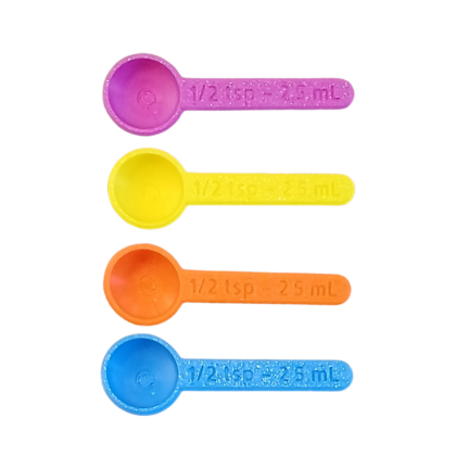 cuillère doseuse correspondant à une demi cuillère à café ou à thé de différentes couleurs